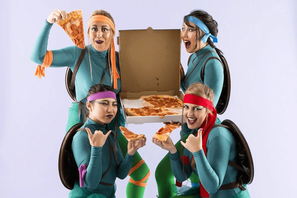 Four women in Teenage Mutant Ninja Turtles group costume inspiration for Halloween trail running