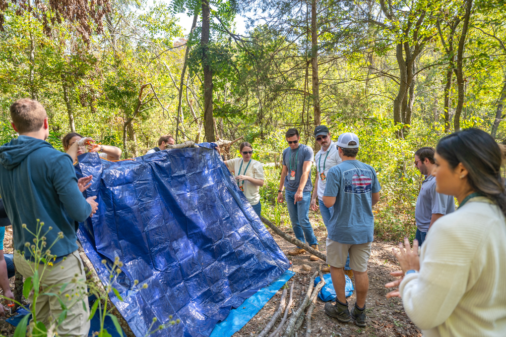 Teams exploring diverse ecosystems during nature scavenger hunt team building activity at Coler Mountain Bike Preserve