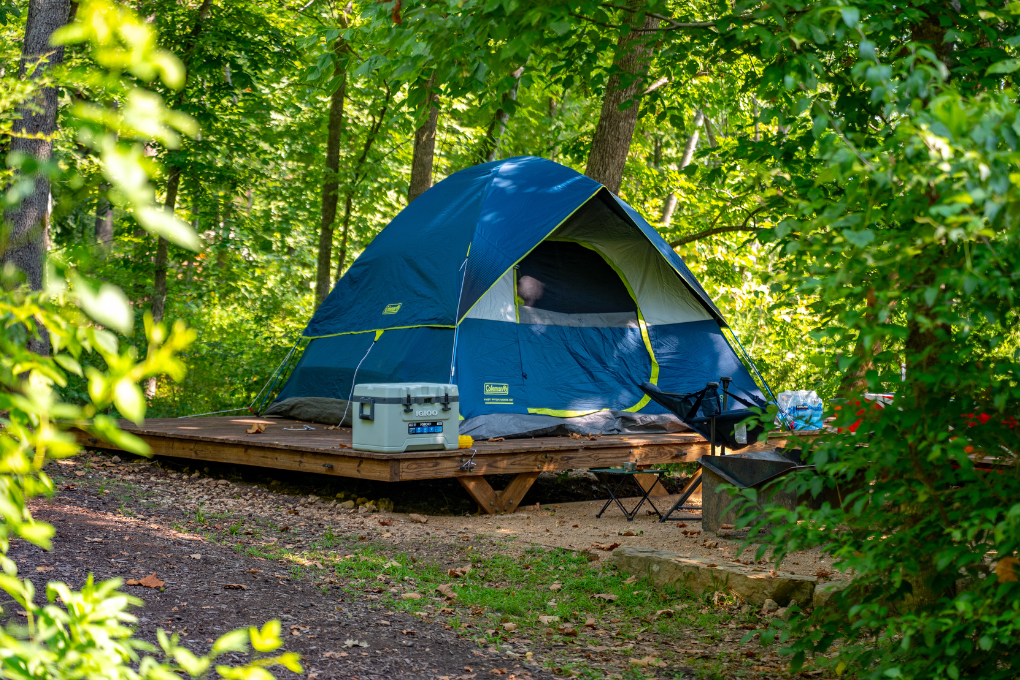 Mountain bike parked near tent campsite during spring camping in Bentonville Arkansas at Coler Preserve